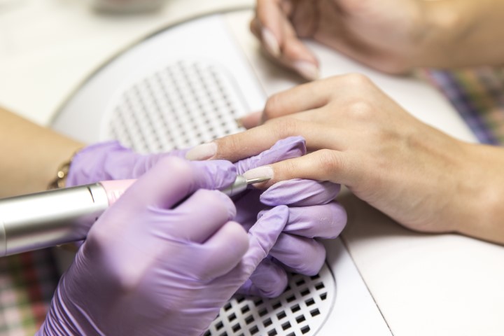 Session of the manicure in the beauty salon.