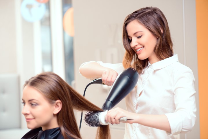 Beautiful woman in hair salon