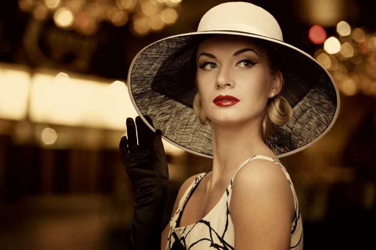 Woman in hat over blurred background.