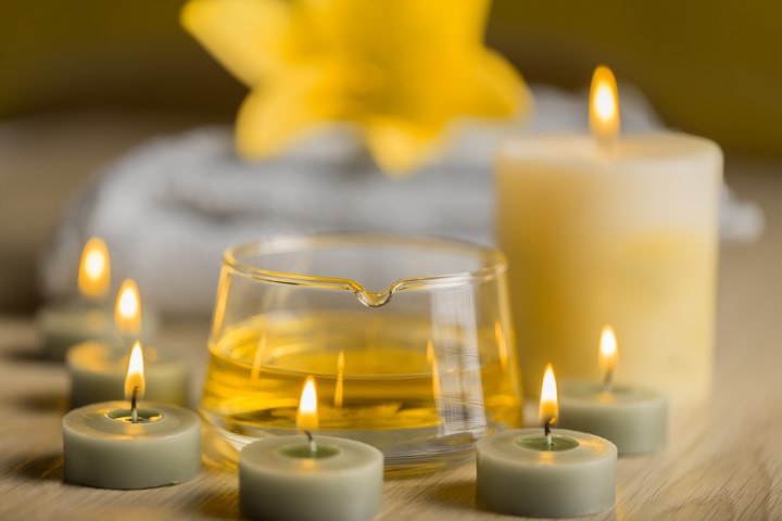SPA still life with herbal oil, spa candles and towel